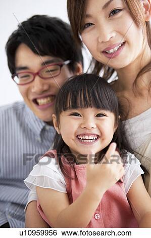 Family sitting on sofa View Large Photo Image Stock Photograph - Family sitting on sofa . Fotosearch
