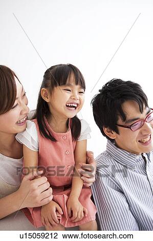 Stock Image - Family smiling. Fotosearch