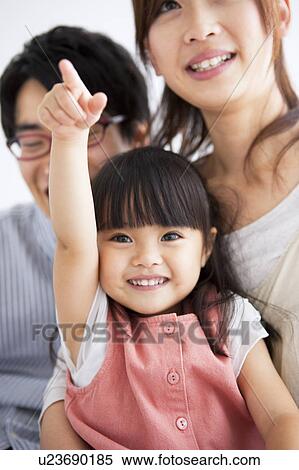 Stock Photography - Family smiling. Fotosearch