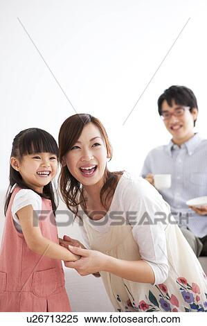 Stock Photography - Family smiling. Fotosearch
