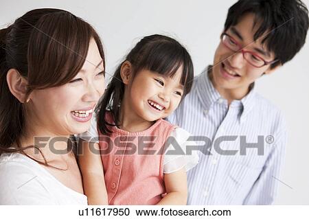 Family standing and smiling View Large Photo Image Stock Image - Family standing and smiling. Fotosearch