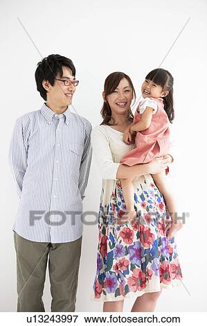 Family standing and smiling View Large Photo Image Stock Photo - Family standing and smiling. Fotosearch