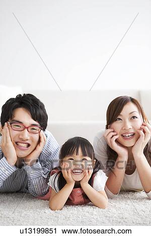 Family with hands on chins View Large Photo Image Stock Image - Family with hands on chins. Fotosearch