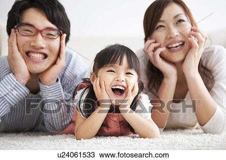 Family with hands on chins View Large Photo Image Stock Image - Family with hands on chins. Fotosearch
