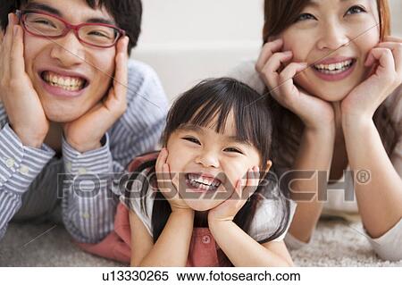 Family with hands on chins View Large Photo Image Stock Photography - Family with hands on chins. Fotosearch