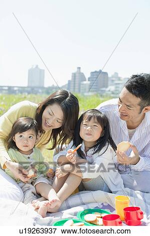 Famly of Four Having Picnic View Large Photo Image Stock Photo - Famly of Four Having Picnic. Fotosearch