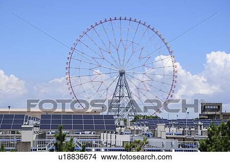 Ferris Wheel and Water Purification Plant View Large Photo Image Picture - Ferris Wheel and Water Purification Plant. Fotosearch
