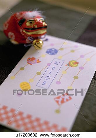 Figurine of lion shishimai Japanese money envelope View Large Photo Image Stock Image - Figurine of lion shishimai Japanese money envelope. Fotosearch