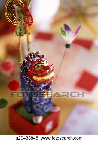 Stock Photo - Figurine of lion shishimai. Fotosearch