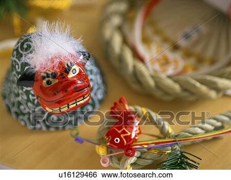 Stock Photograph - Figurine of lion shishimai. Fotosearch