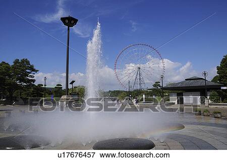 Stock Photo - Fountain and Ferris Wheel. Fotosearch