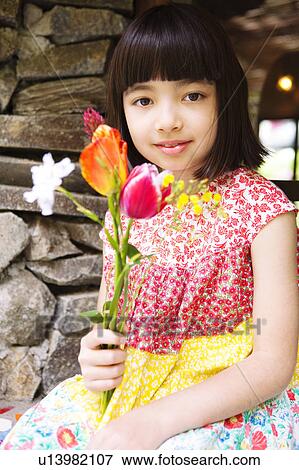 Girl Holding Bunch of Flowers View Large Photo Image Stock Photo - Girl Holding Bunch of Flowers. Fotosearch