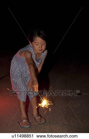 Girl Holding Sparkler at Night View Large Photo Image Stock Image - Girl Holding Sparkler at Night. Fotosearch