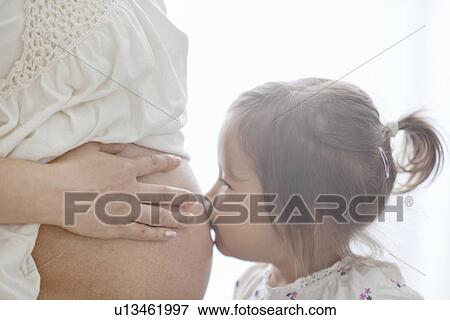 Girl Kissing Her Pregnant Mother's Belly View Large Photo Image Stock Photo - Girl Kissing Her Pregnant Mother's Belly. Fotosearch