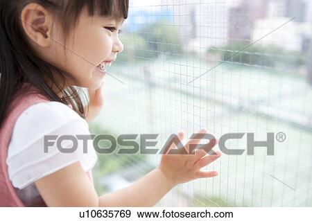 Girl looking out the window View Large Photo Image Stock Photo - Girl looking out the window. Fotosearch