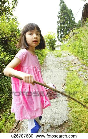 Girl on Footpath Holding Stick View Large Photo Image Stock Image - Girl on Footpath Holding Stick. Fotosearch