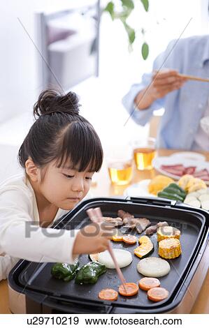 Girl Taking Vegetable From Grill View Large Photo Image Stock Photo - Girl Taking Vegetable From Grill. Fotosearch