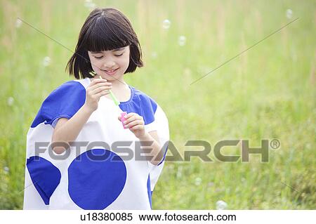 Stock Photography - Girl with Bubble Wand. Fotosearch