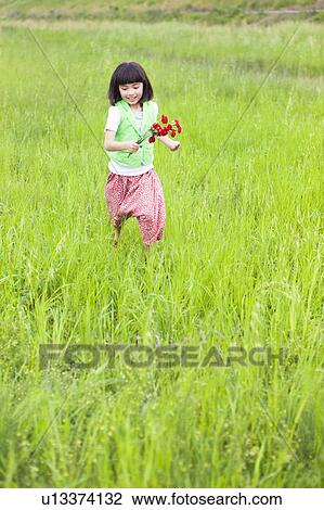 Girl with Bunch of Flowers in Field View Large Photo Image Stock Image - Girl with Bunch of Flowers in Field. Fotosearch