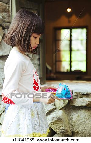 Stock Photo - Girl with Toy Tray and Teapot. Fotosearch