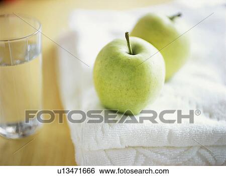 Green apples, Glass of water and towels View Large Photo Image Stock Photograph - Green apples, Glass of water and towels. Fotosearch