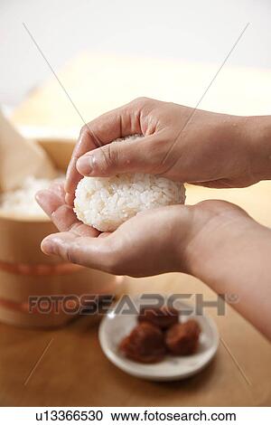 Hands making a rice ball View Large Photo Image Stock Image - Hands making a rice ball. Fotosearch