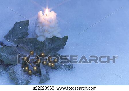Stock Photo - Holly Decoration and Candle. Fotosearch