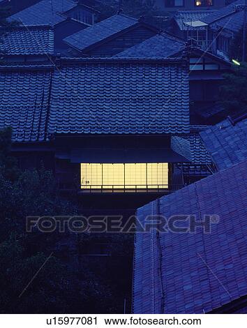 Stock Image - House Window Illuminated at Evening. Fotosearch