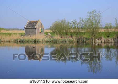 Hut and Trees Reflected in River View Large Photo Image Stock Photograph - Hut and Trees Reflected in River. Fotosearch