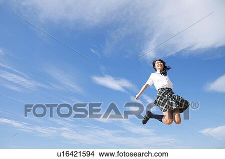 Picture - Junior High School girl jumping. Fotosearch