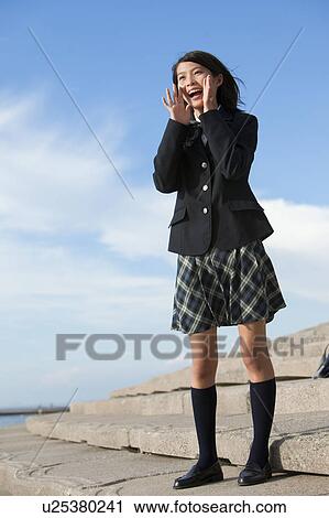Stock Image - Junior High School girl screaming. Fotosearch