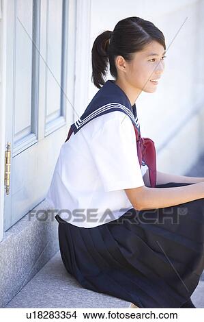 Picture - Junior High School girl sitting. Fotosearch