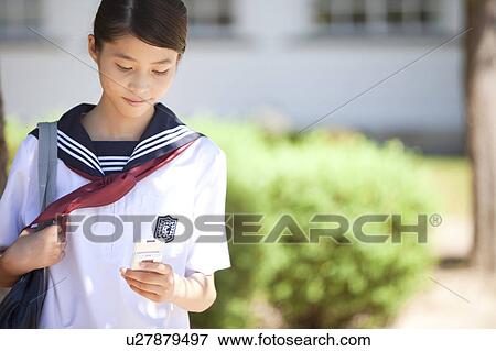 Junior High School girl text messaging View Large Photo Image Stock Photo - Junior High School girl text messaging. Fotosearch