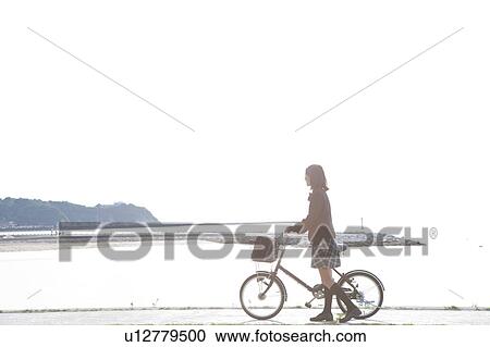Junior High School girl with a bicycle View Large Photo Image Stock Image - Junior High School girl with a bicycle. Fotosearch