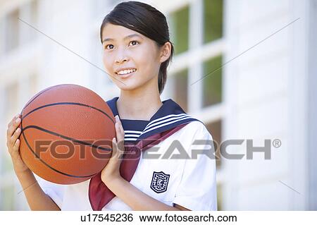 Junior High School girl with a basketball View Large Photo Image Stock Photograph - Junior High School girl with a basketball. Fotosearch