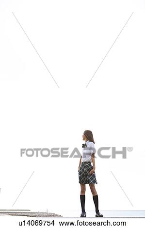 Picture - Junior High School girl with hand on hip. Fotosearch