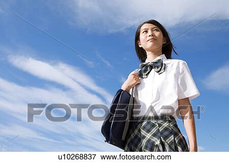 Stock Photo - Junior High School girl with shoulder bag. Fotosearch