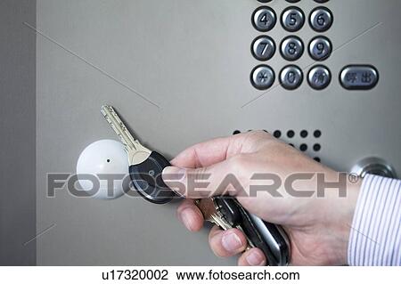 Stock Image - Man Using Intercom. Fotosearch