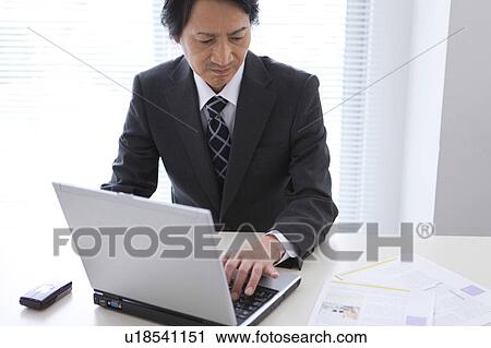 Mature man using laptop View Large Photo Image Stock Image - Mature man using laptop. Fotosearch
