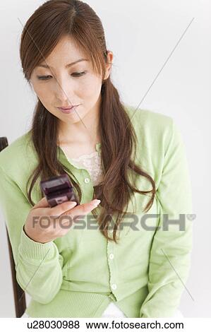 Mid Adult Text Messaging View Large Photo Image Stock Photo - Mid Adult Text Messaging. Fotosearch