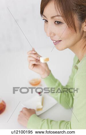 Mid Adult Woman Eating Cake View Large Photo Image Stock Photography - Mid Adult Woman Eating Cake. Fotosearch