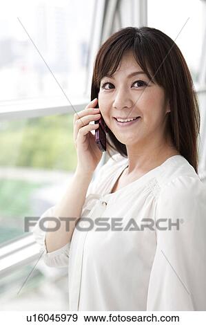 Mid Adult Woman on Phone View Large Photo Image Stock Photo - Mid Adult Woman on Phone. Fotosearch