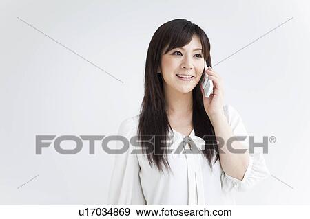 Mid Adult Woman on Phone View Large Photo Image Stock Photo - Mid Adult Woman on Phone. Fotosearch