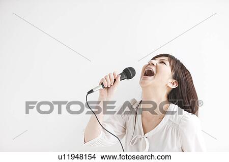Picture - Mid Adult Woman Singing. Fotosearch