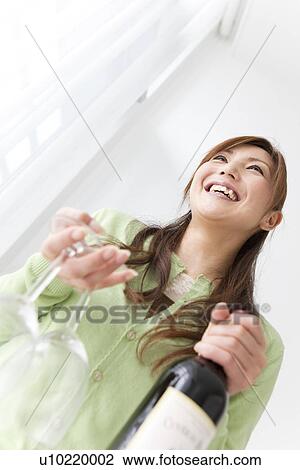 Stock Image - Mid Adult Woman With Red Wine. Fotosearch