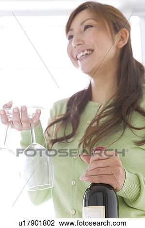 Stock Image - Mid Adult Woman With Red Wine. Fotosearch