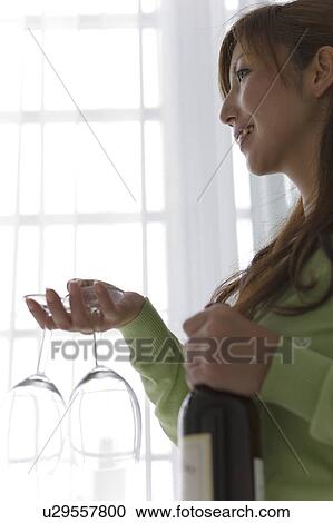 Stock Image - Mid Adult Woman With Red Wine. Fotosearch