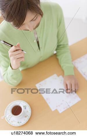 Mid Adult Woman Writing Letter View Large Photo Image Stock Photo - Mid Adult Woman Writing Letter. Fotosearch