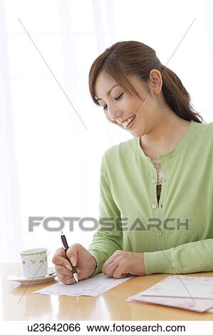 Mid Adult Woman Writing Letter View Large Photo Image Stock Photograph - Mid Adult Woman Writing Letter. Fotosearch