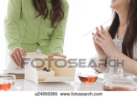 Mid Adult Women Having Cake and Tea View Large Photo Image Stock Photography - Mid Adult Women Having Cake and Tea. Fotosearch